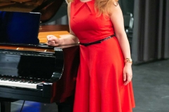 Post-concert: Violeta Burany on stage by Yamaha CF concert grand. Photo by Marion Voysey