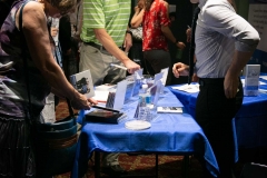 Post-concert, Euterpe Officer John Nicholson selling Ensemble Vivant CDs to interested audience members.  Photo by Marion Voysey