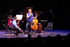 Ensemble Vivant’s cellist Sybil Shanahan speaking to audience; Corey Gemmell, violin; Catherine Wilson, piano. Photo by Marion Voysey