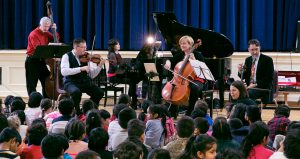 Ensemble Vivant performing for young students at Rose Ave Jr PS